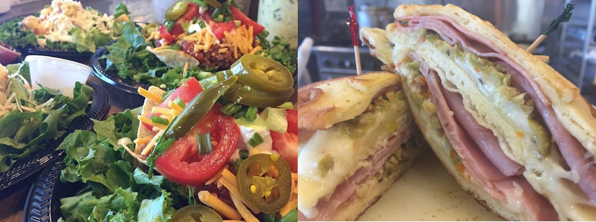 Sandwich and colorful salad platter with greens, peppers, and toasted bread slices on a table