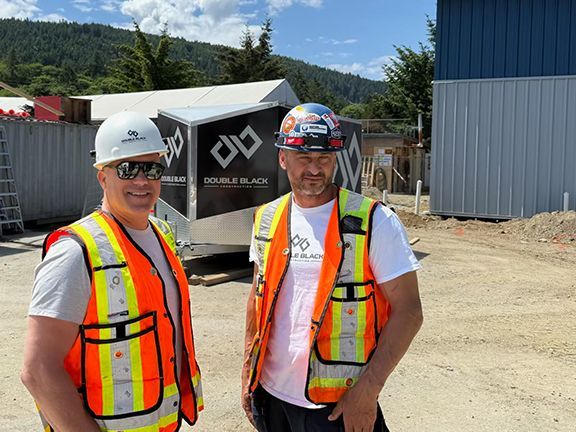 Frank Melo and John Lohan on site overseeing PEMB erection on Salt Spring Island building project.