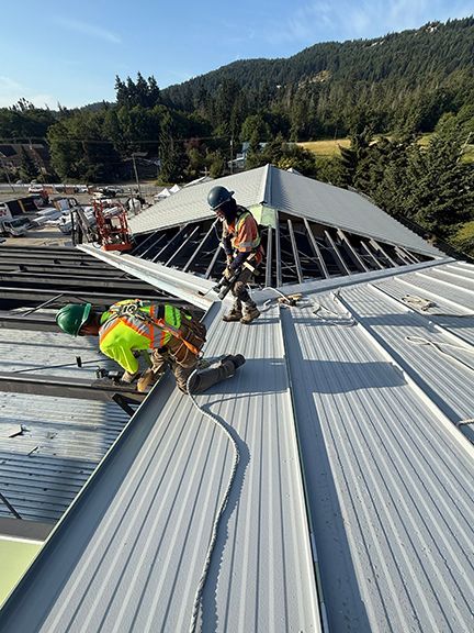 Construction work continues on the metal roof system in British Columbia.