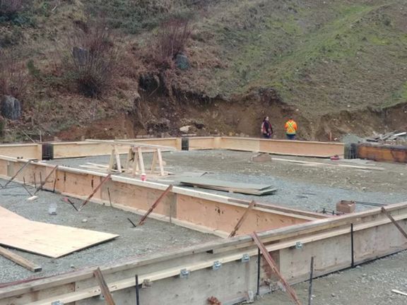 A group of people are working on a construction site.