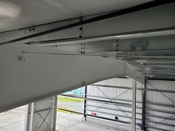 A close up of a metal structure in a building.