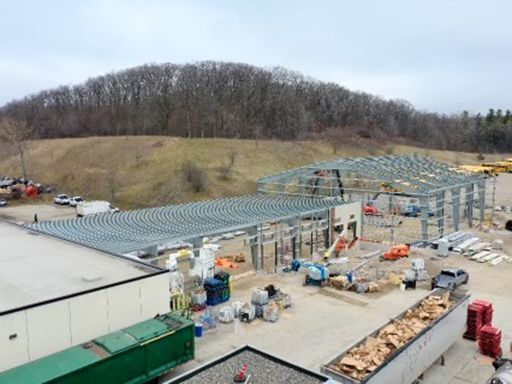 An aerial view of a large building under construction.