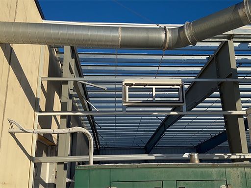 A metal structure with pipes coming out of it