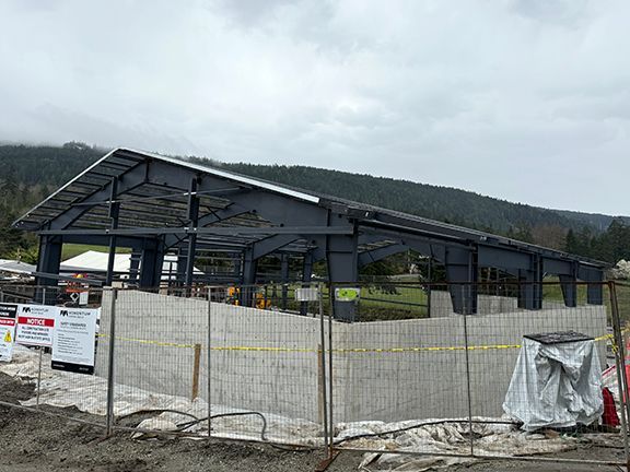 Closer look at water proofing sheets for a commercial metal building factory in BC.
