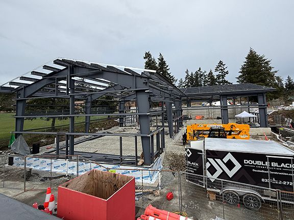 Look at a Double Black Construction building project site in British Columbia, including vinyl-wrapped trailer.