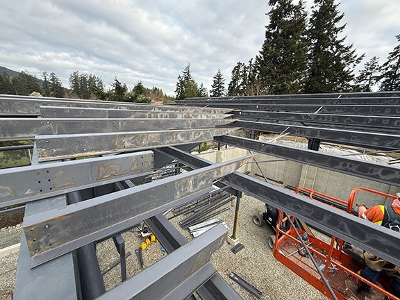 Close look at the metal roofing system for an industrial pre-engineered steel building.