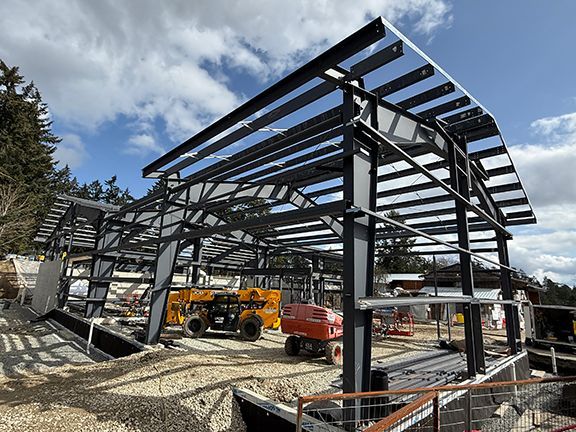 Roofing frame and components using pre-engineered steel systems.