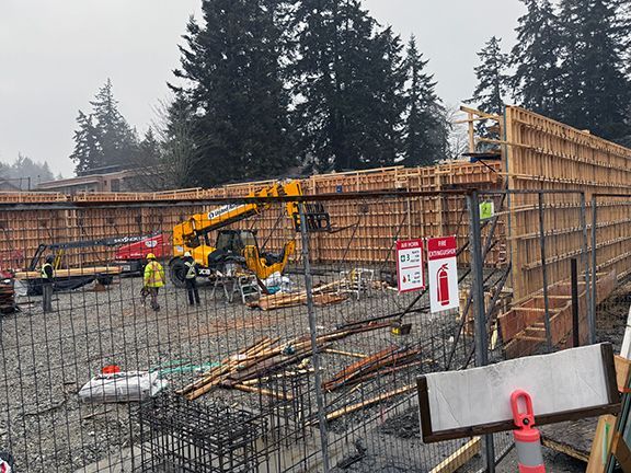 Work continues on wooden forms ahead of pouring concrete in British Columbia project.