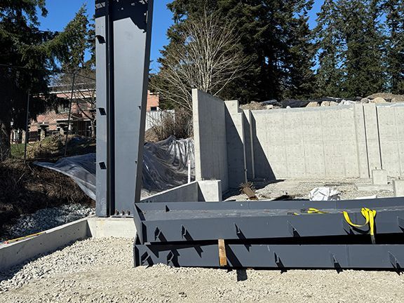 Closer look at steel structural beams installed by Double Black Construction.
