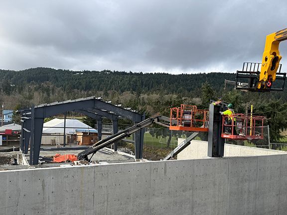 Building framing as seen overtop the concrete foundation wall in British Columbia.