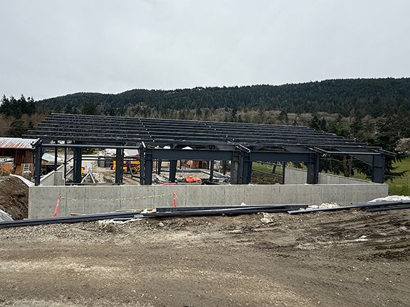 Steel roofing components easily visible at construction site.
