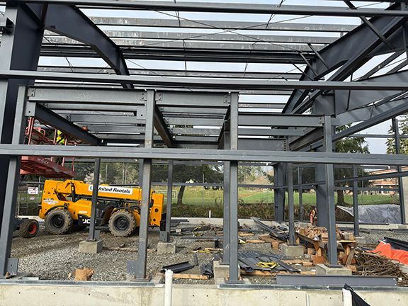 Side view showing wall component frames for steel manufacturing building.
