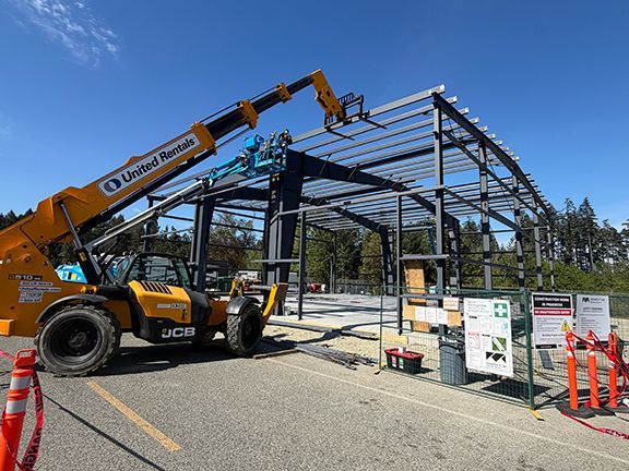 Lift truck and crane being used at PEMB building project in BC