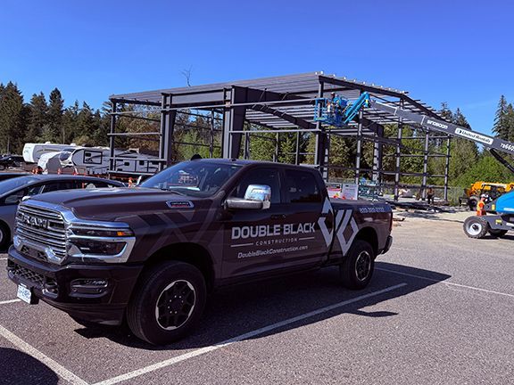 Double Black Construction truck parks in front of PEMB project in Nanaimo.