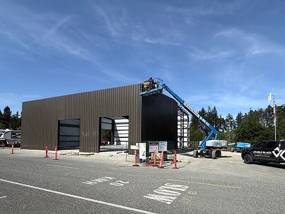 Wall components are lifted into place at BC construction site