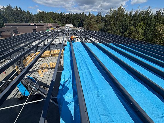 Canvas added to roof framing at PEMB project in B.C.