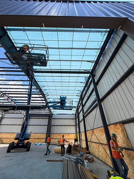 Interior photo shows addition of roof panels and waterproof wall lining