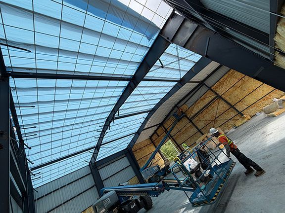 Interior look at insulation and roofing being added to PEMB project