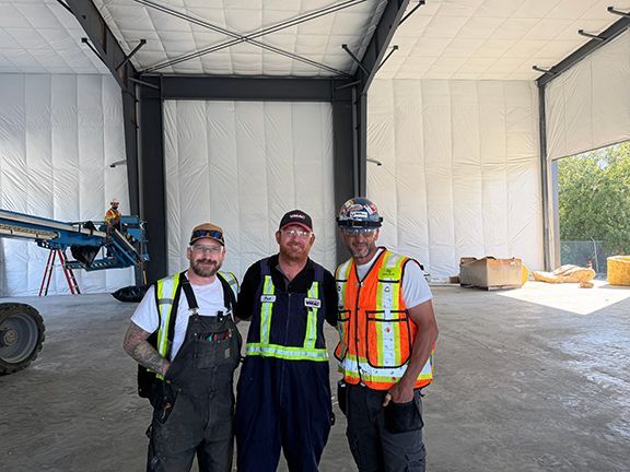John Lohan, engineers and tradesperson inside a PEMB project in BC.