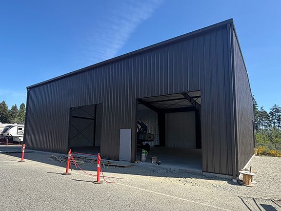 Pre-engineered metal building construction nearing completion.
