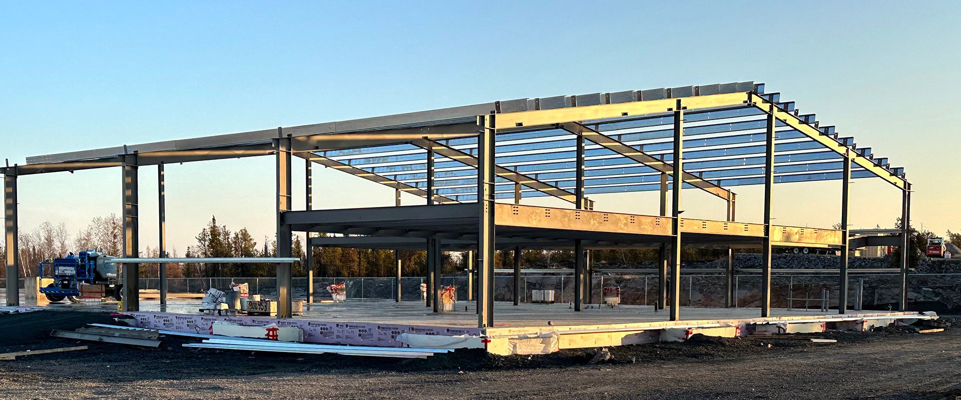 Double Black Construction installs steel primary framing at a jobsite in Yellowknife.