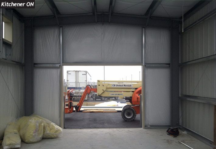 A jlg crane is parked inside of a building