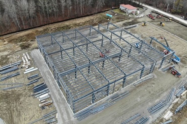 An aerial view of a large building under construction.