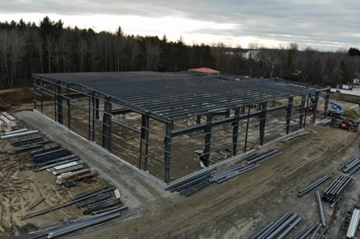 An aerial view of a large building under construction.