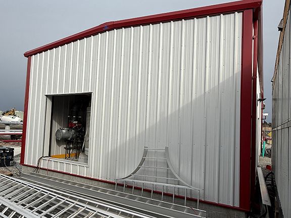 Completed end view of the Vancouver Airport fuel pump house showing equipment inside.