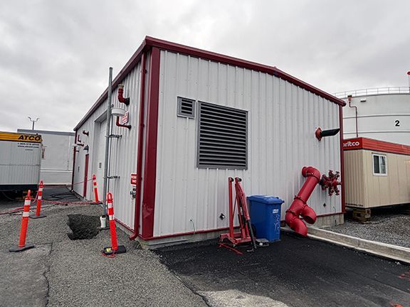 Exterior side view of Double Black Construction's jet fuel pump facility project