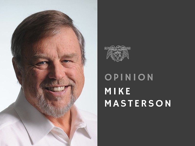 A man with a beard is smiling in front of a sign that says opinion mike masterson
