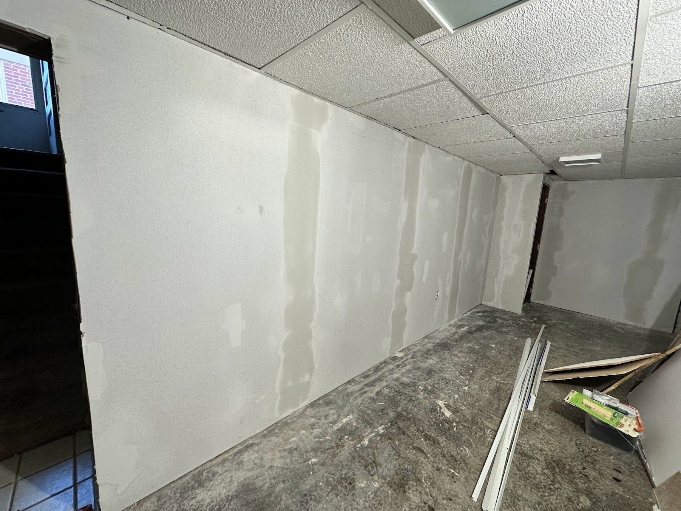 A room with a ceiling and a wall that is being remodeled.