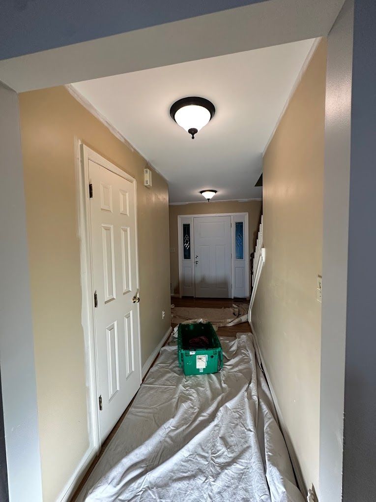 A hallway with a green box in the middle of it.