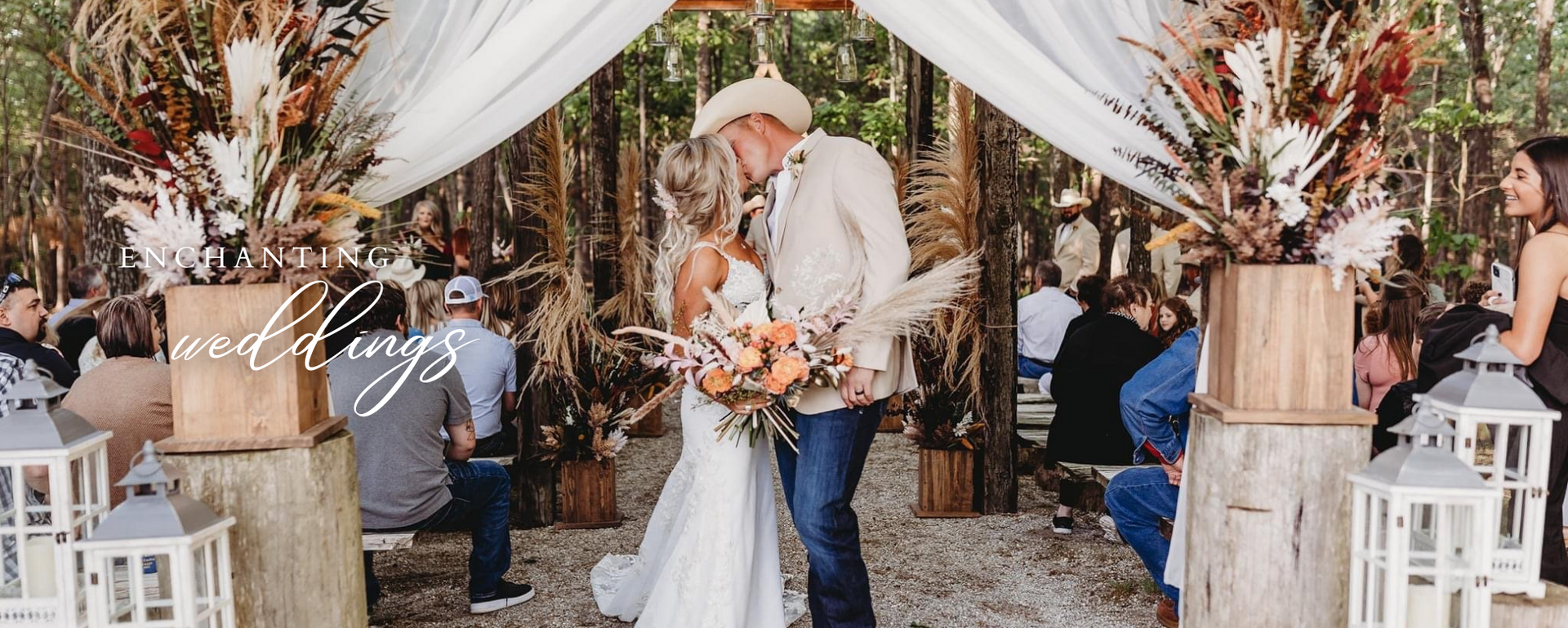 Bride and groom exchanging vows under white drapes at a rustic outdoor wedding ceremony