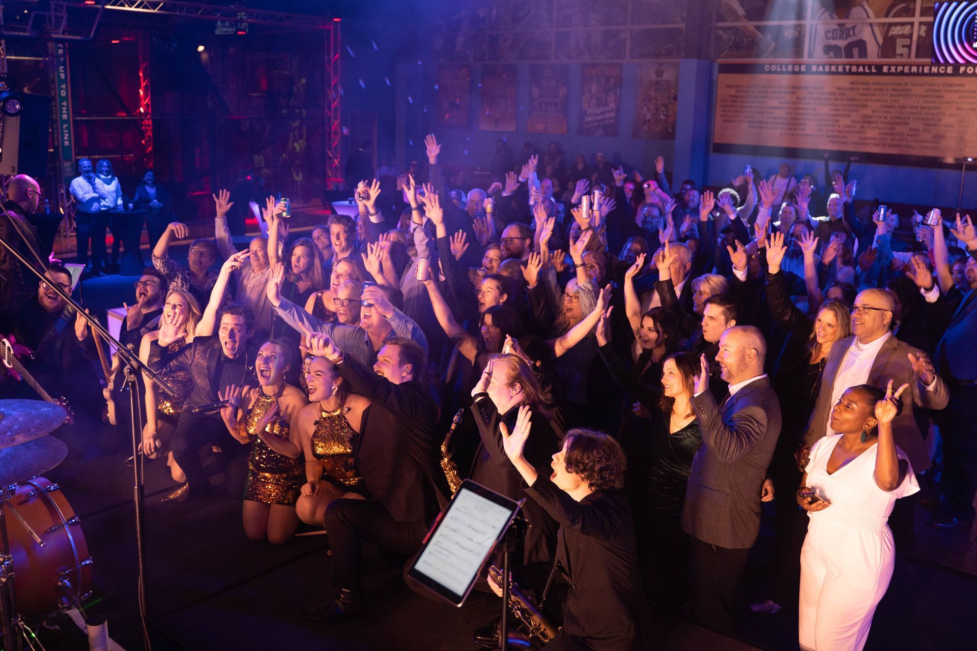 Professional photograph of a big party with a band and people are having fun.