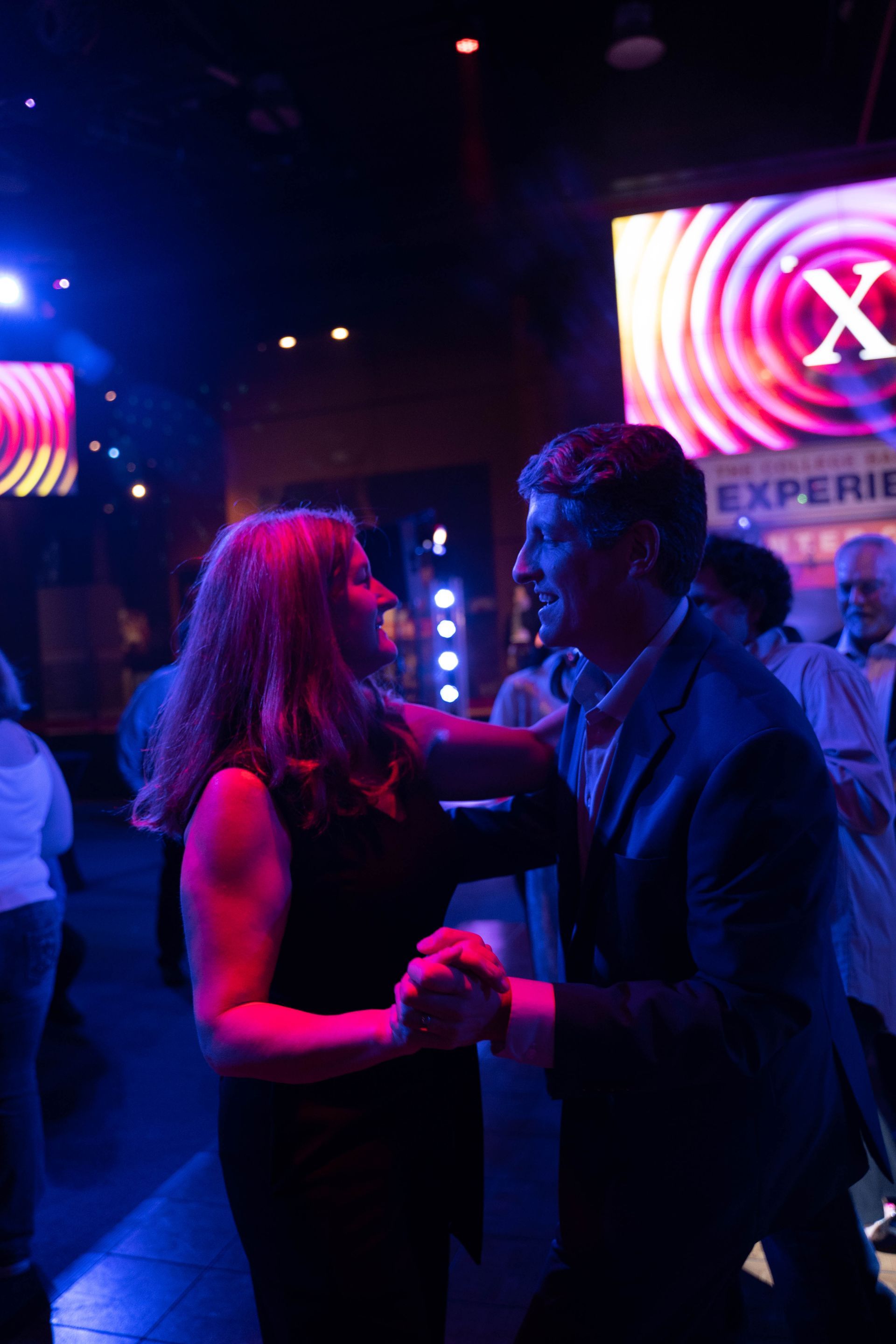 Professional photograph of a big party with a band and people are dancing.
