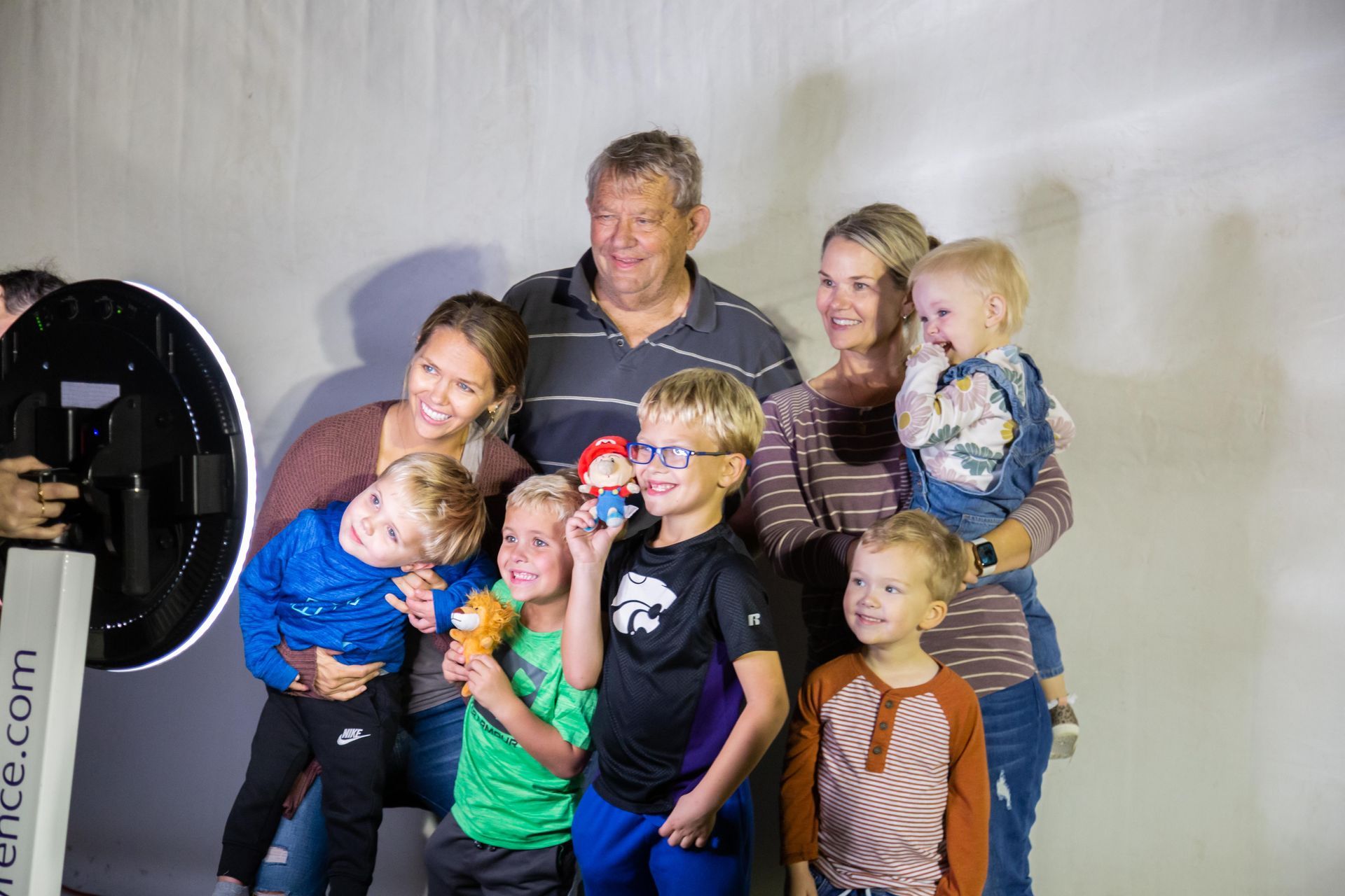 Professional photograph of a family getting their picture taken.