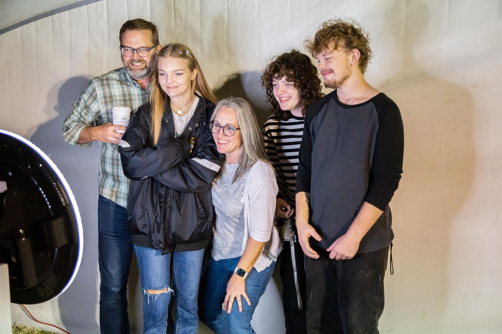 Professional photograph of a family getting their picture taken.
