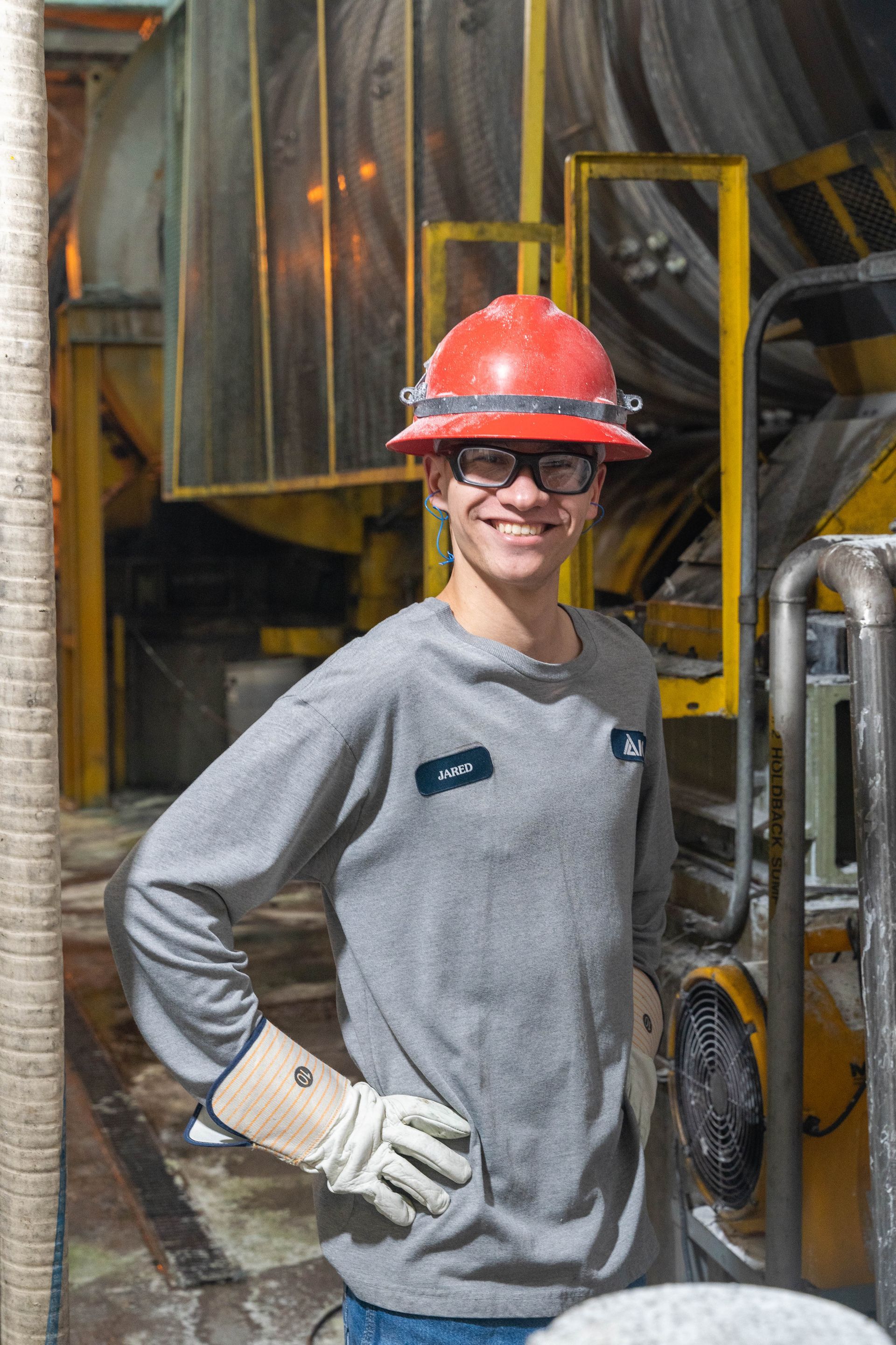 Professional advertisement of man working in a factory that was taken by KMG.
