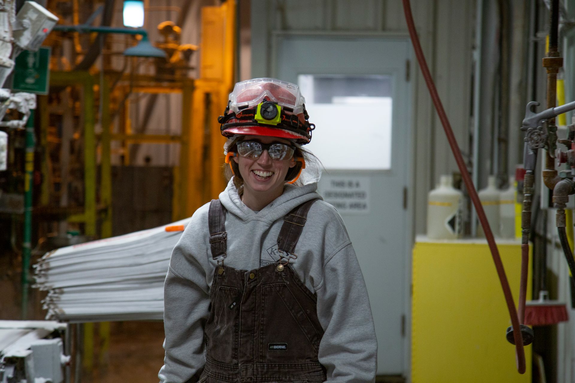 Professional advertisement of woman working in a factory that was taken by KMG.