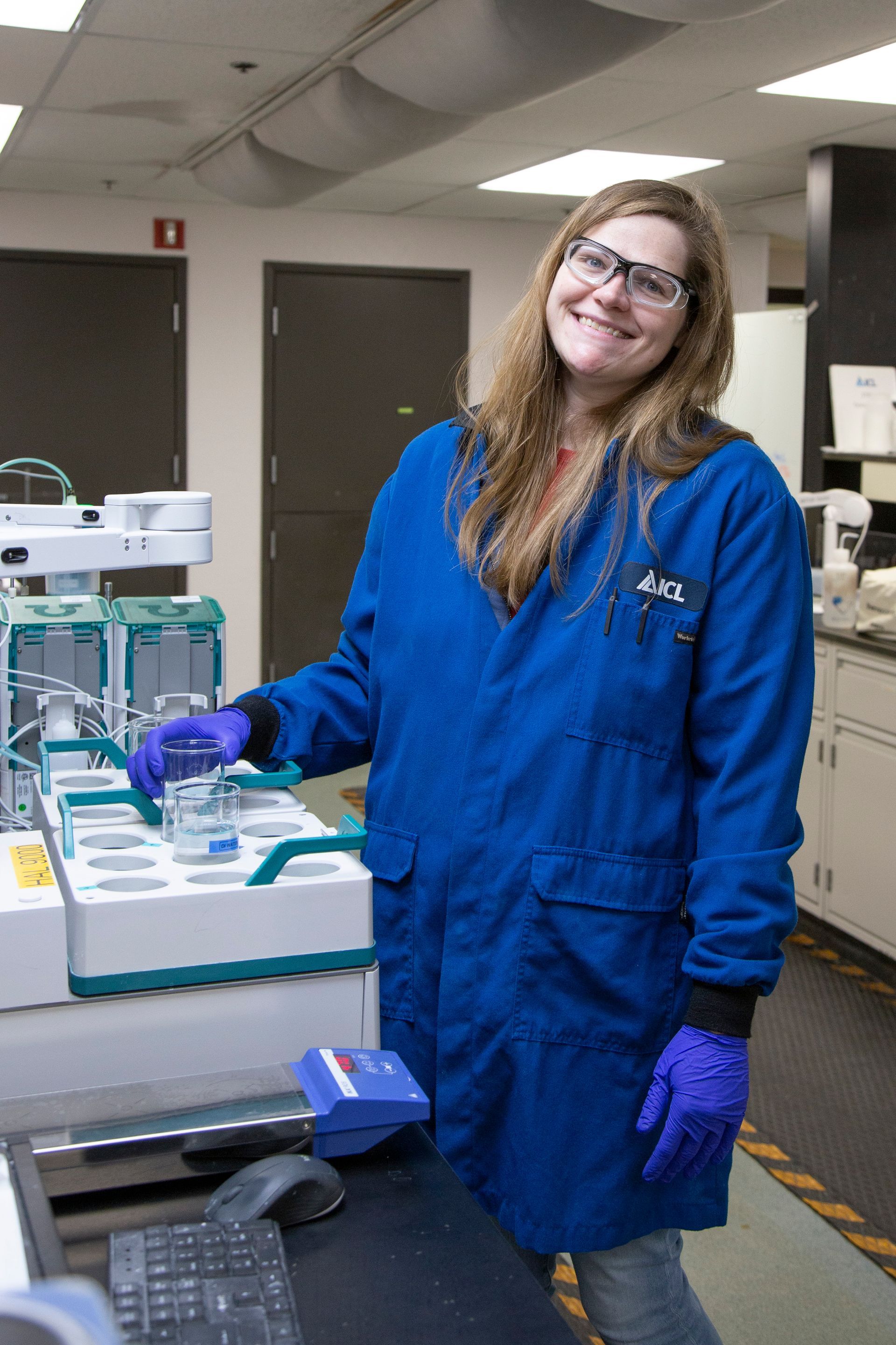 Professional advertisement of woman working in a lab that was taken by KMG.
