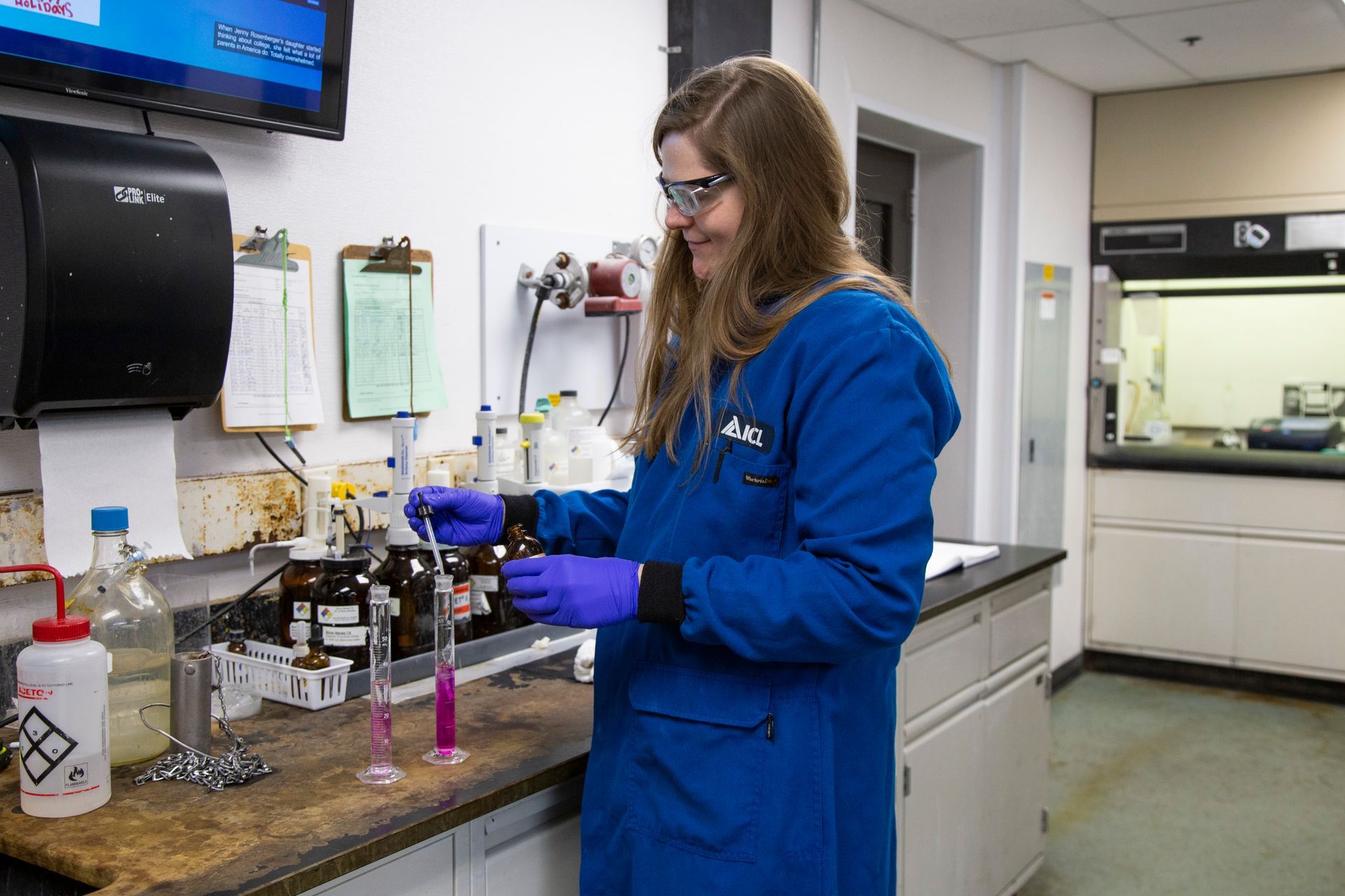 Professional photograph of a woman working in a lab.