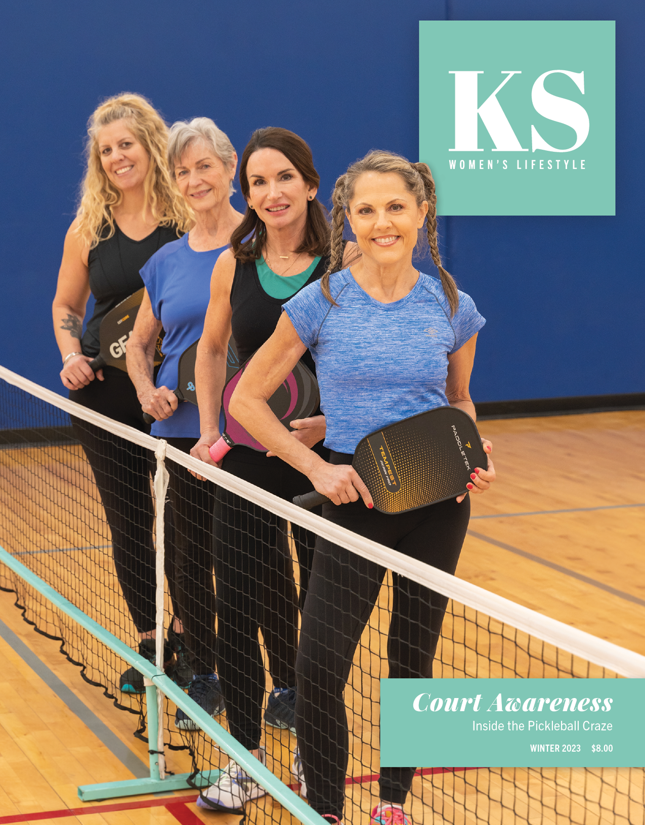 Professional photograph of women standing and holding sports paddles.