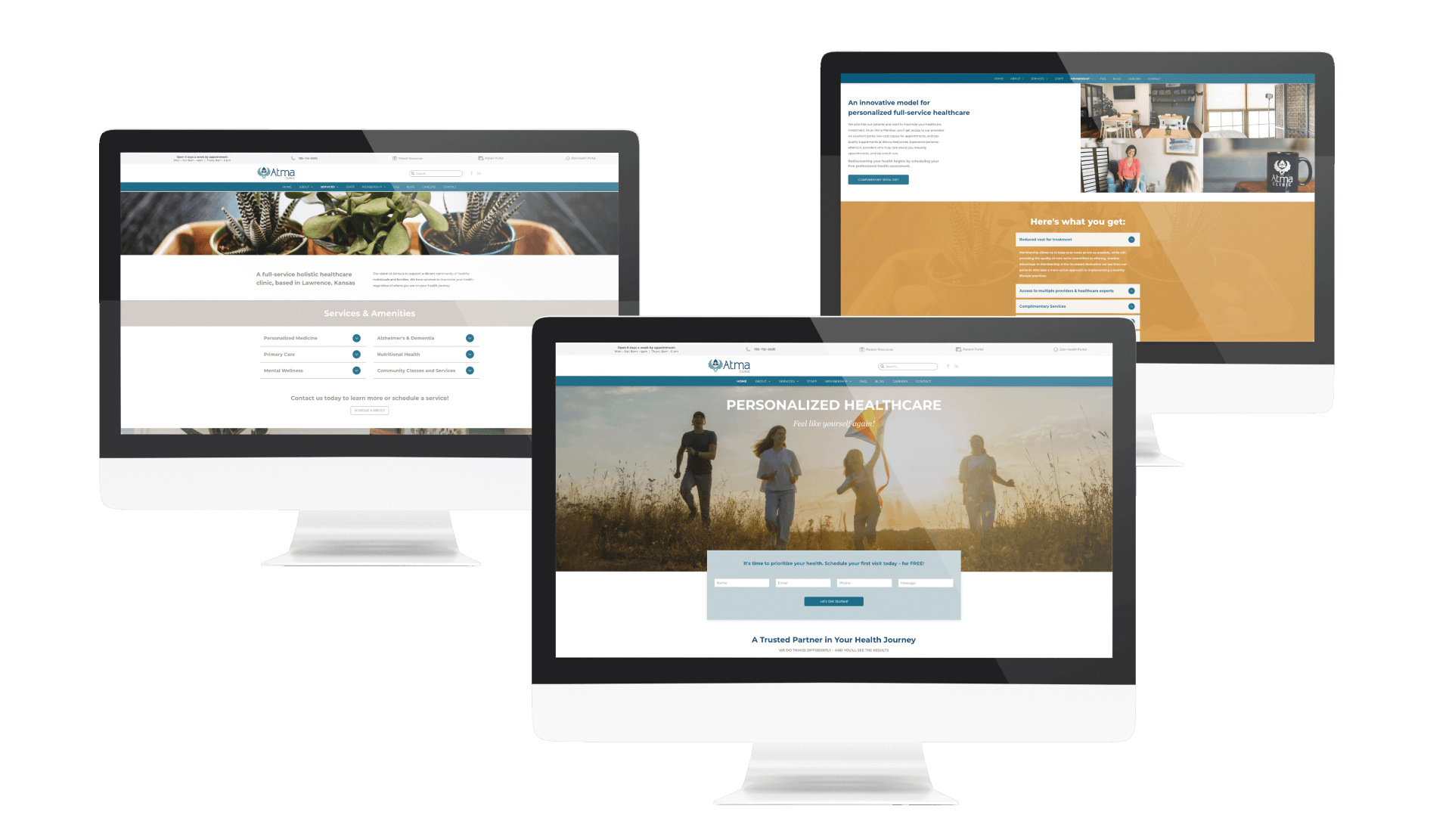 three computer monitors are displaying different websites on a white background .