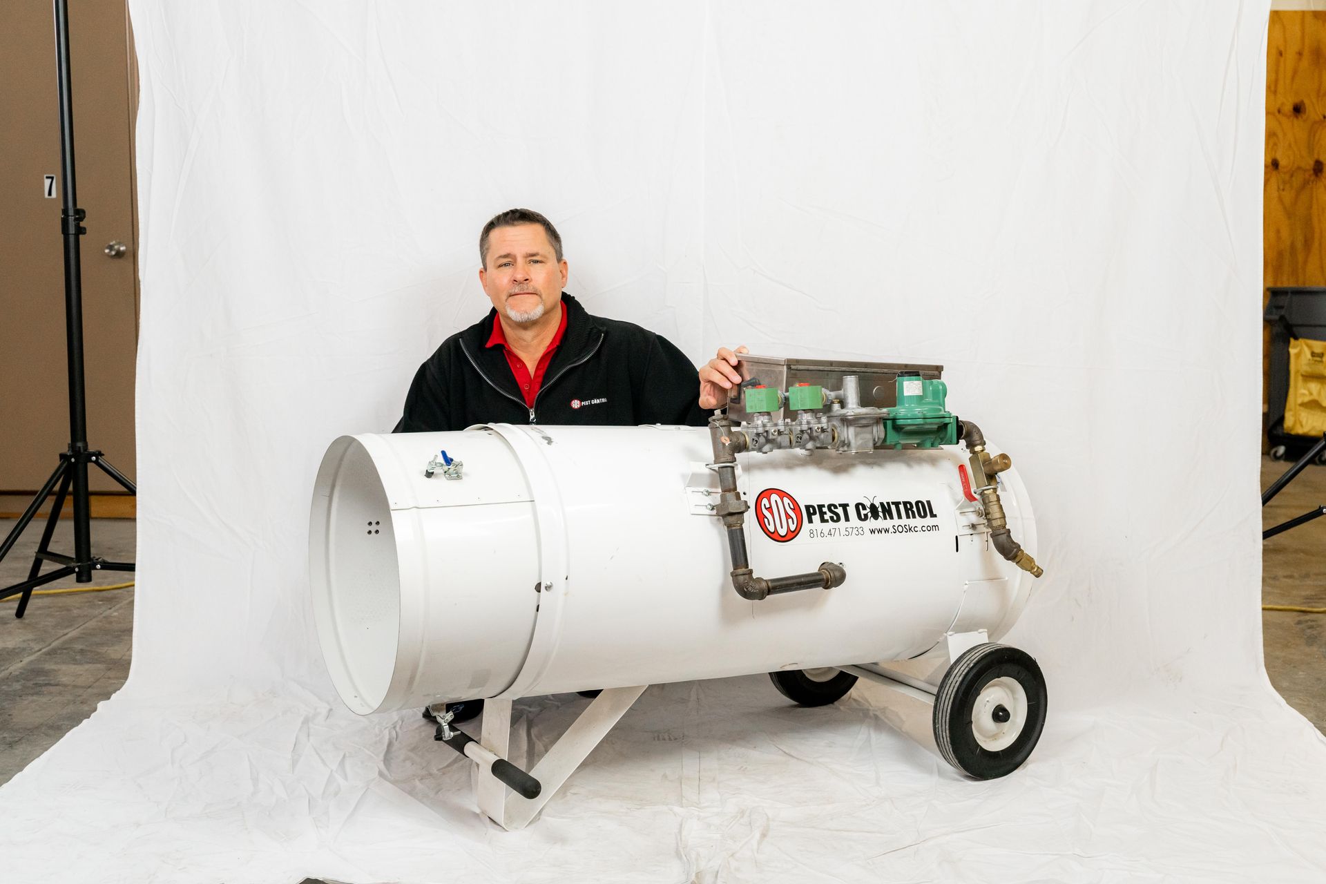 Professional photograph of SOS Pest Control owner and equipment.