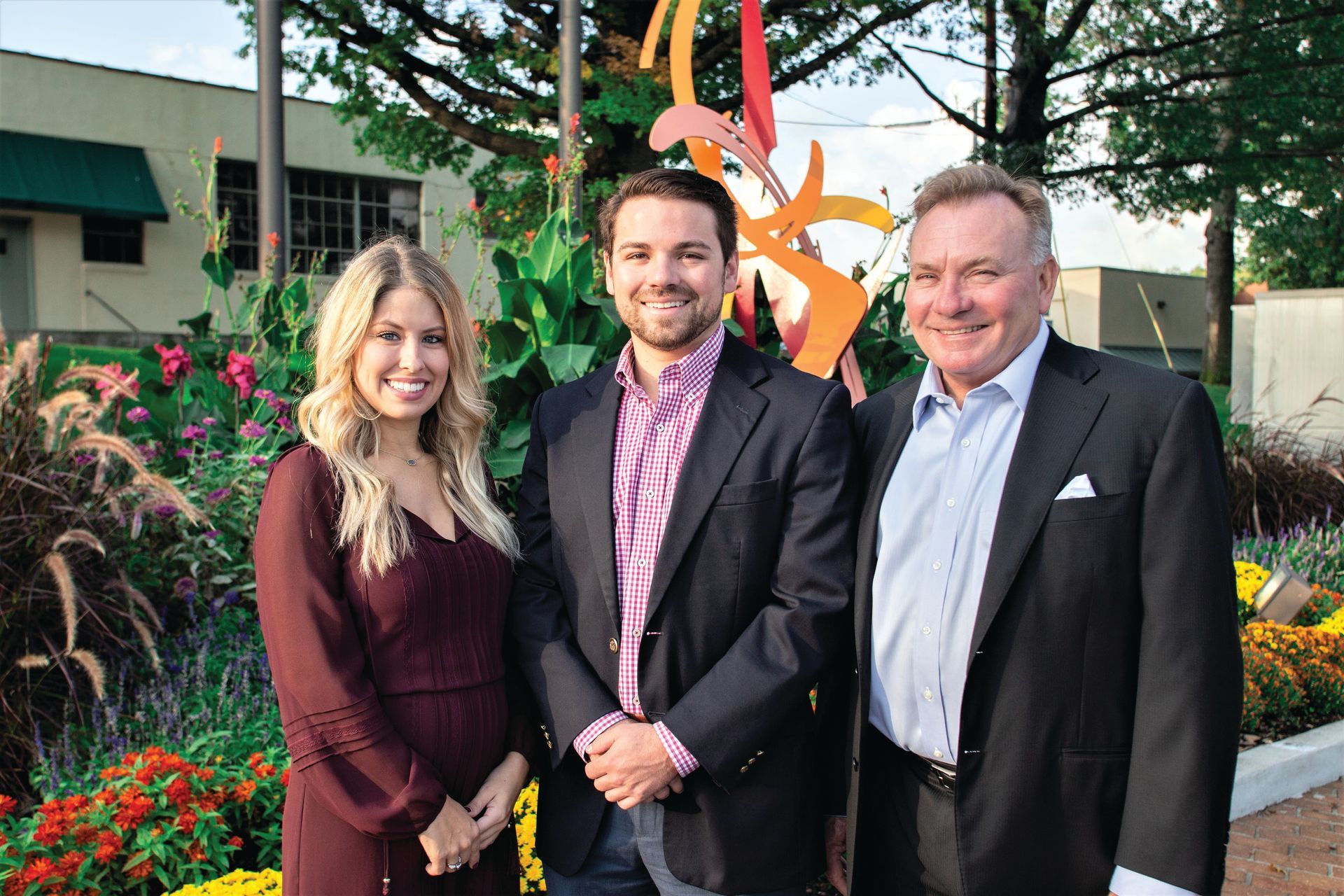 Professional photograph of people standing on a building taken by KMG.