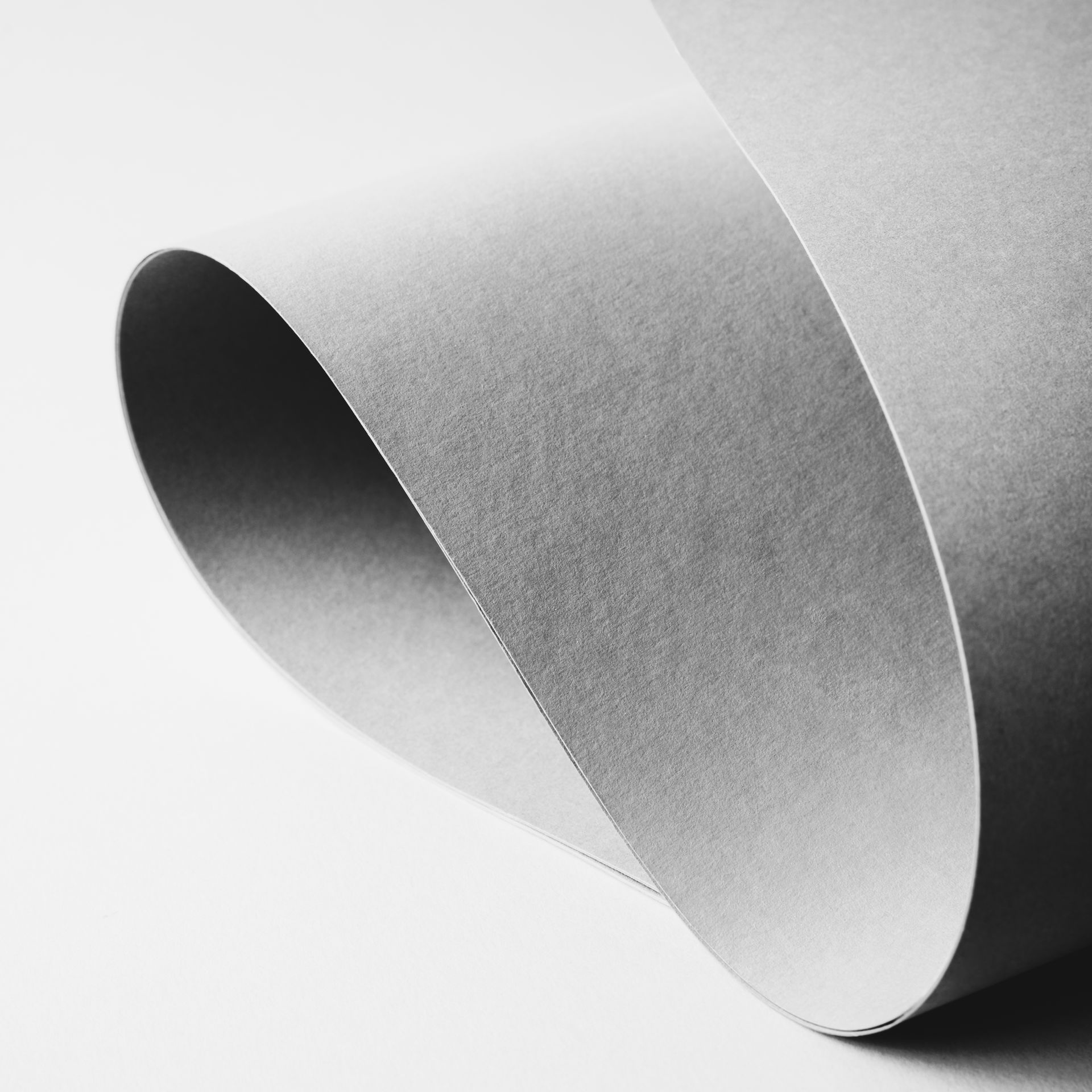 textured gray paper that is twisted up.