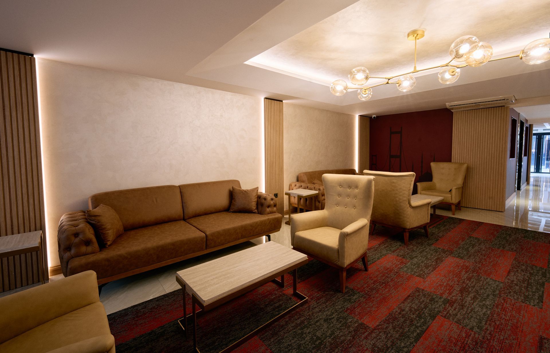 A living room with a couch , chairs , and a table.