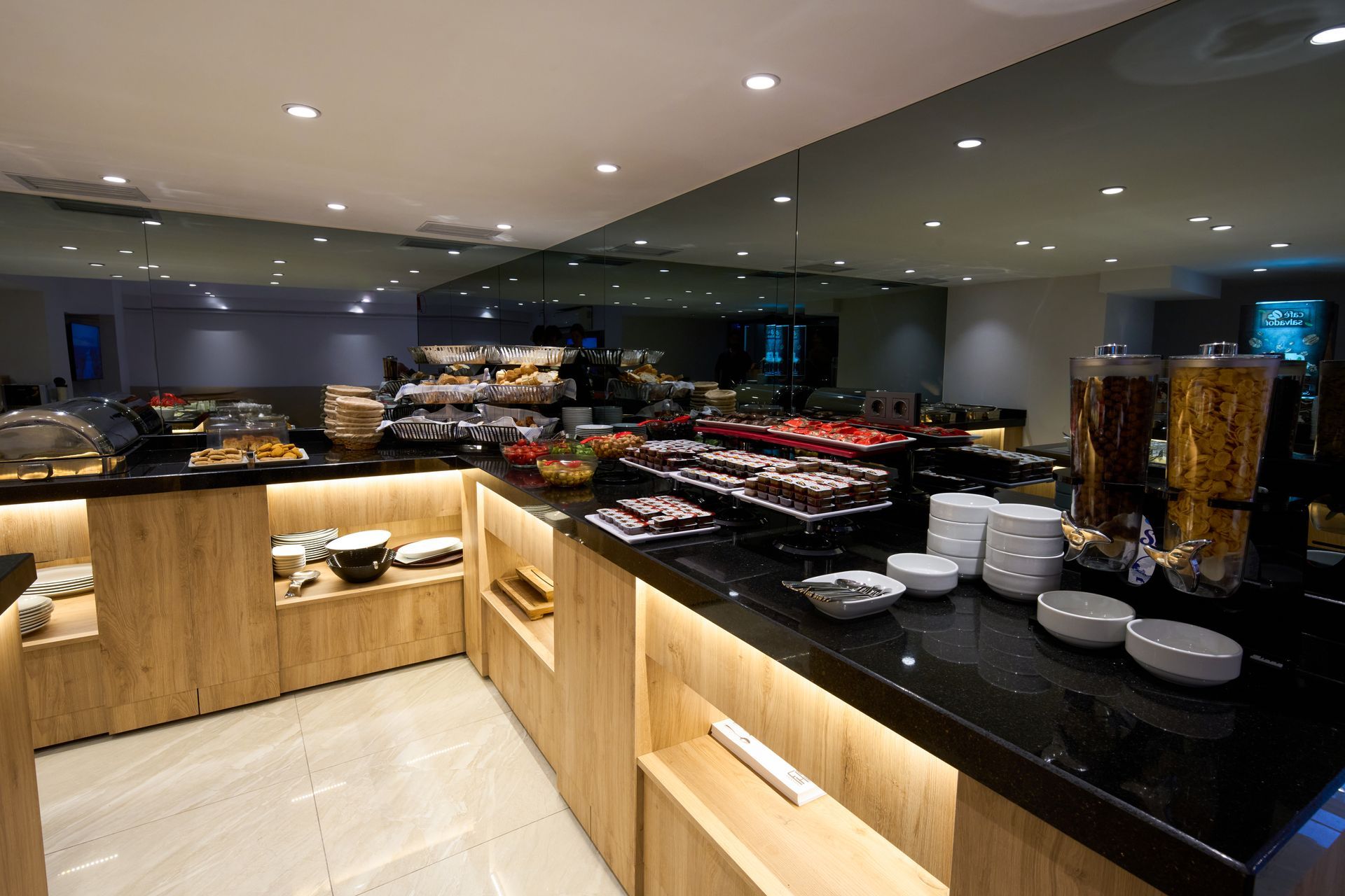 A buffet with a lot of food on it in a restaurant.