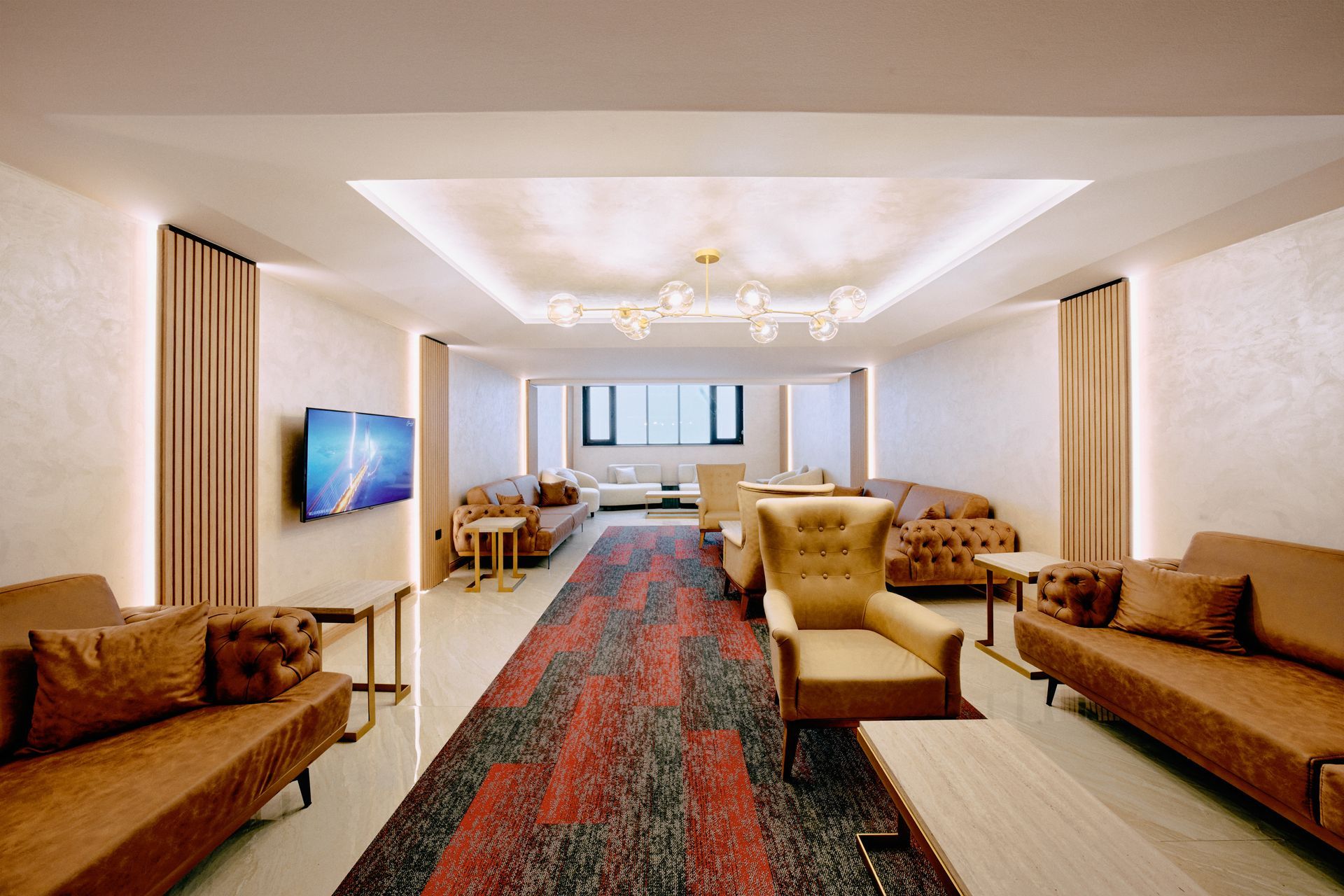 A living room filled with furniture and a television.